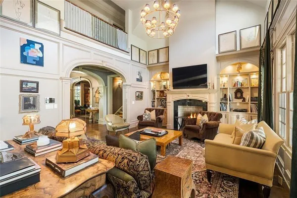 a kitchen with a wooden floor and a fireplace