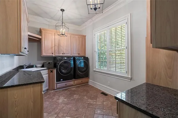 a spacious bathroom with a granite countertop sink and a large mirror