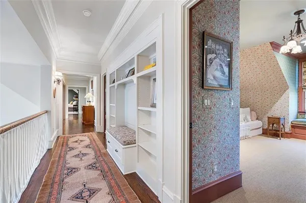 a bathroom with a granite countertop sink toilet and mirror