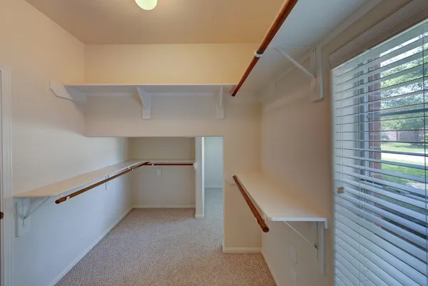 a view of an empty walk in closet