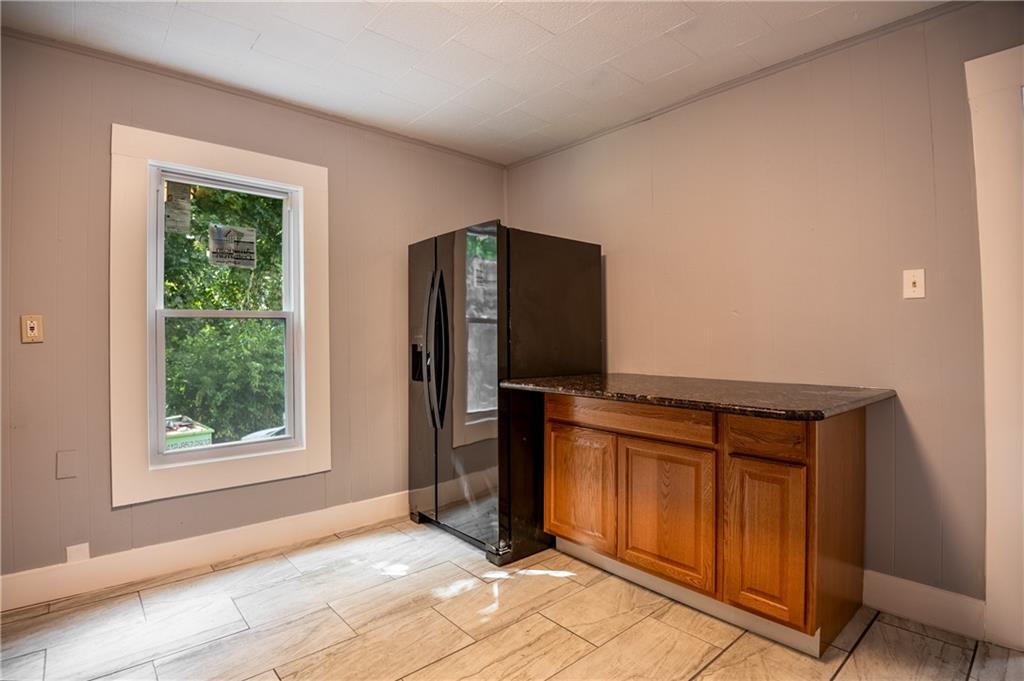 780 South Irvine Avenue, Unit 1 Sharon, PA 16146 - Photo 3 of 10 an empty room with windows and closet