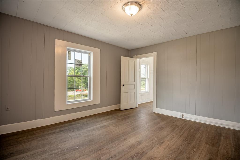 780 South Irvine Avenue, Unit 1 Sharon, PA 16146 - Photo 9 of 10 an empty room with wooden floor and windows