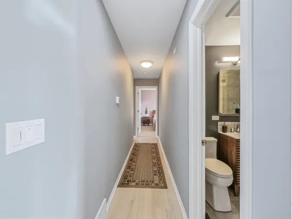 a view of a hallway with toilet