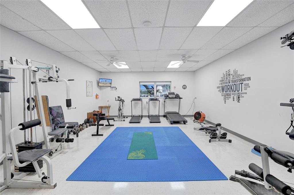 5300 Washington Street, Unit 108D Hollywood, FL 33021 - Photo 28 of 34 a room with lots of gym equipment and wooden floor