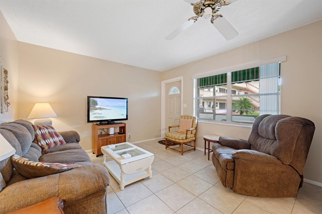 5300 Washington Street, Unit 108D Hollywood, FL 33021 - Photo 5 of 34 a living room with furniture and a large window