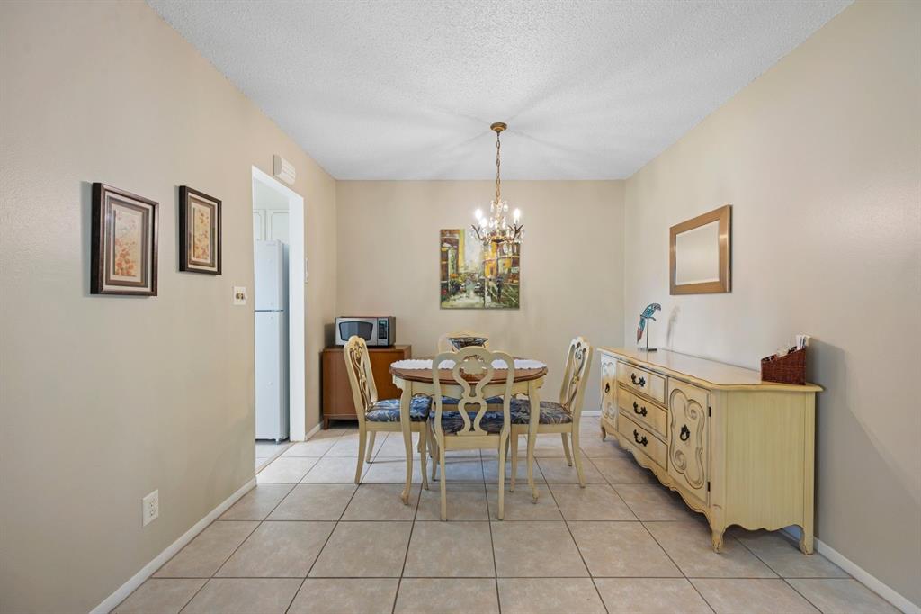5300 Washington Street, Unit 108D Hollywood, FL 33021 - Photo 10 of 34 a view of a dining room with furniture and chandelier