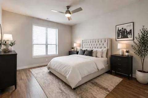 a livingroom with workspace and a couch