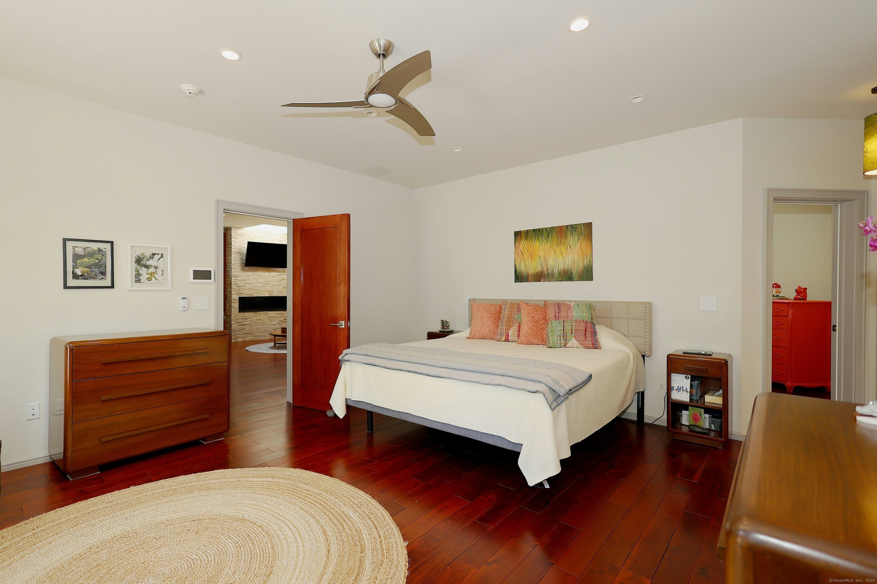 88 Green Lane Ridgefield, CT 06877 - Photo 19 of 40 a spacious bedroom with a bed and a dresser