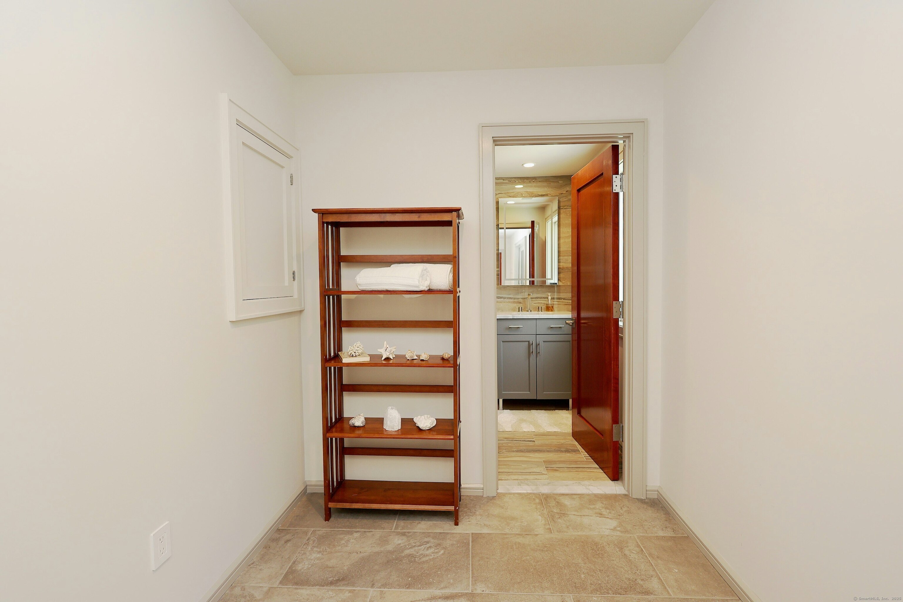 88 Green Lane Ridgefield, CT 06877 - Photo 29 of 40 a view of a hallway with wooden shelves