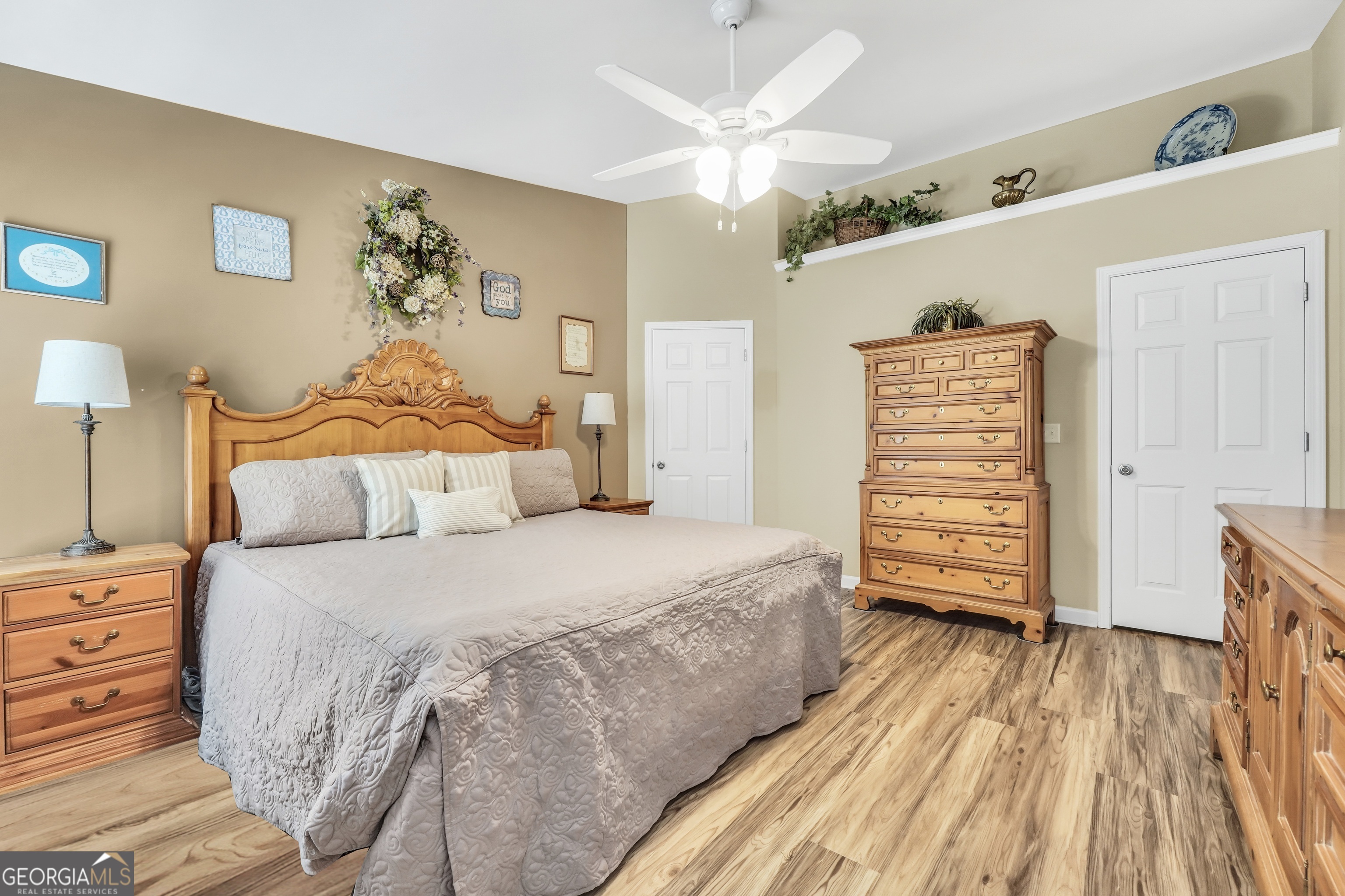 164 Lantana Drive Locust Grove, GA 30248 - Photo 17 of 34 a bedroom with a bed and a chandelier