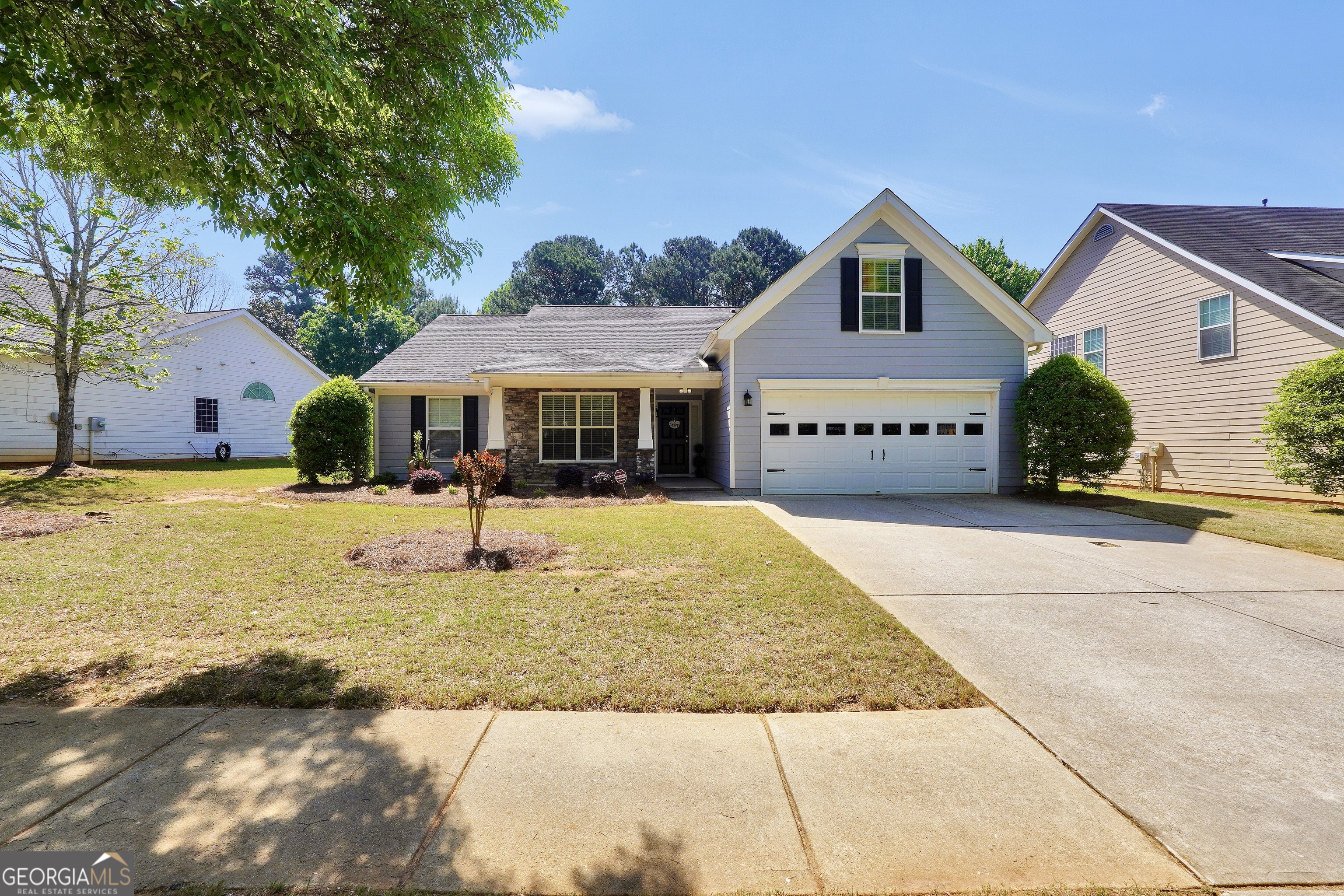 164 Lantana Drive Locust Grove, GA 30248 - Photo 2 of 34 a front view of a house with swimming pool