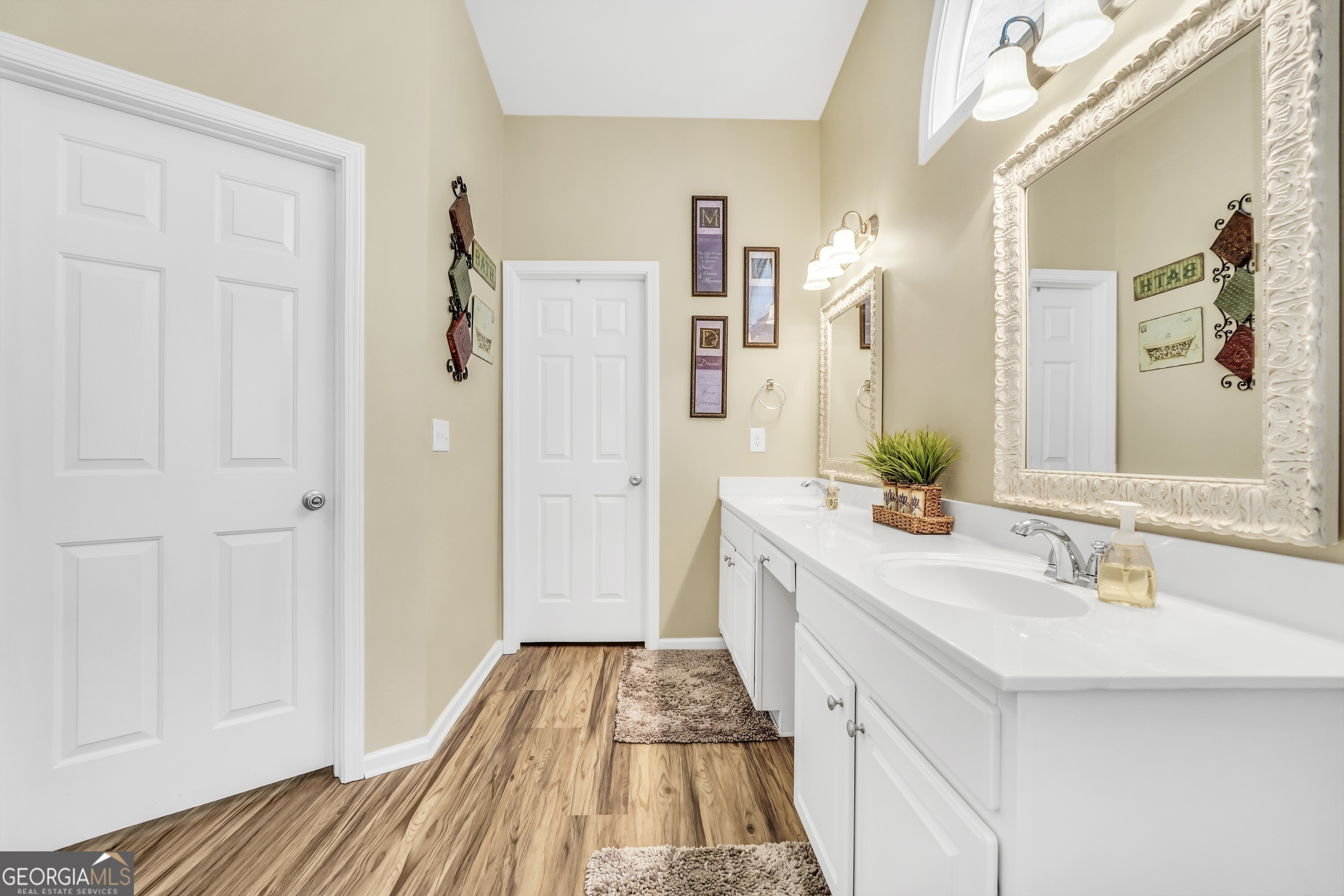 164 Lantana Drive Locust Grove, GA 30248 - Photo 21 of 34 a bathroom with a sink and a mirror