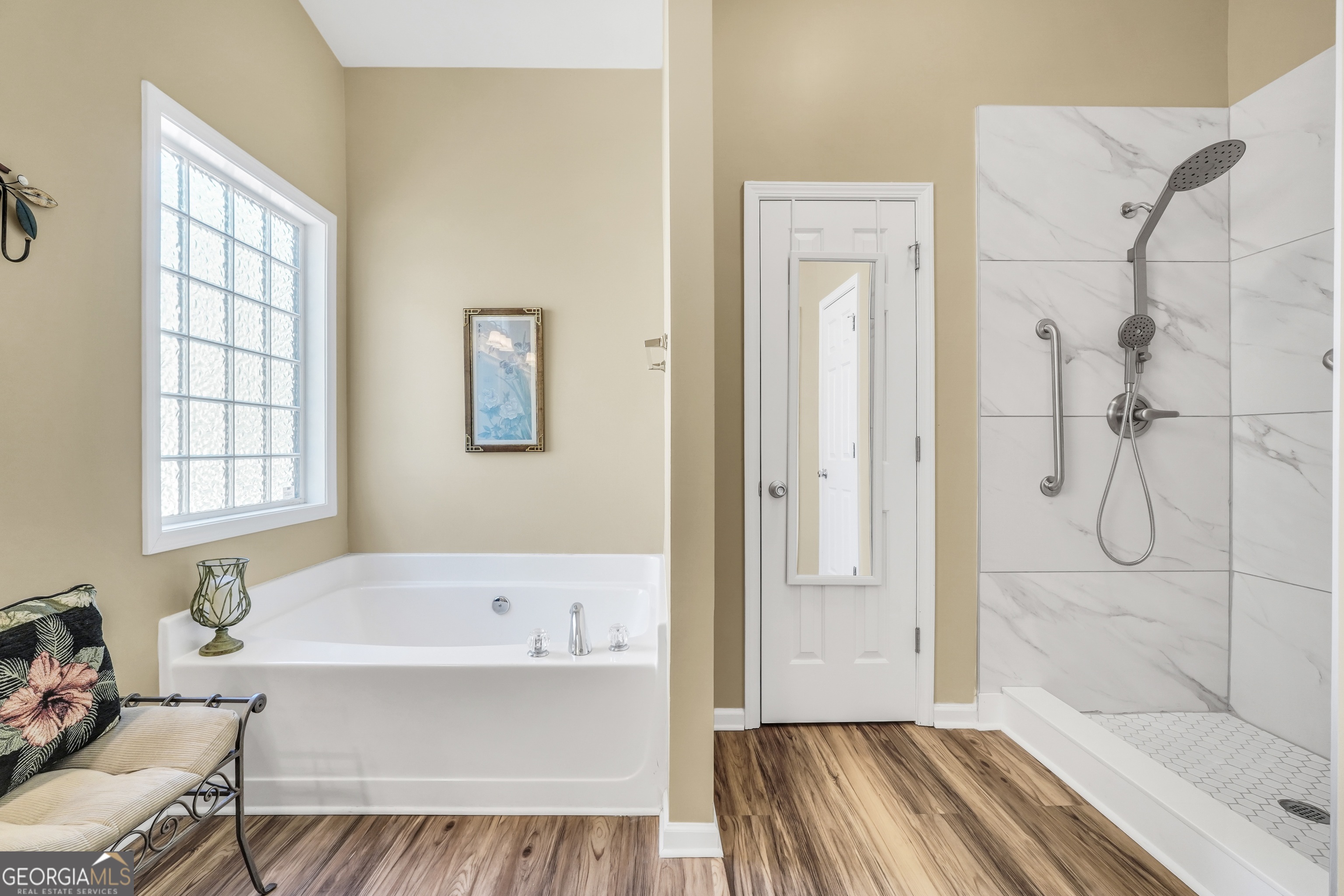 164 Lantana Drive Locust Grove, GA 30248 - Photo 22 of 34 a bathroom with a bathtub and a shower