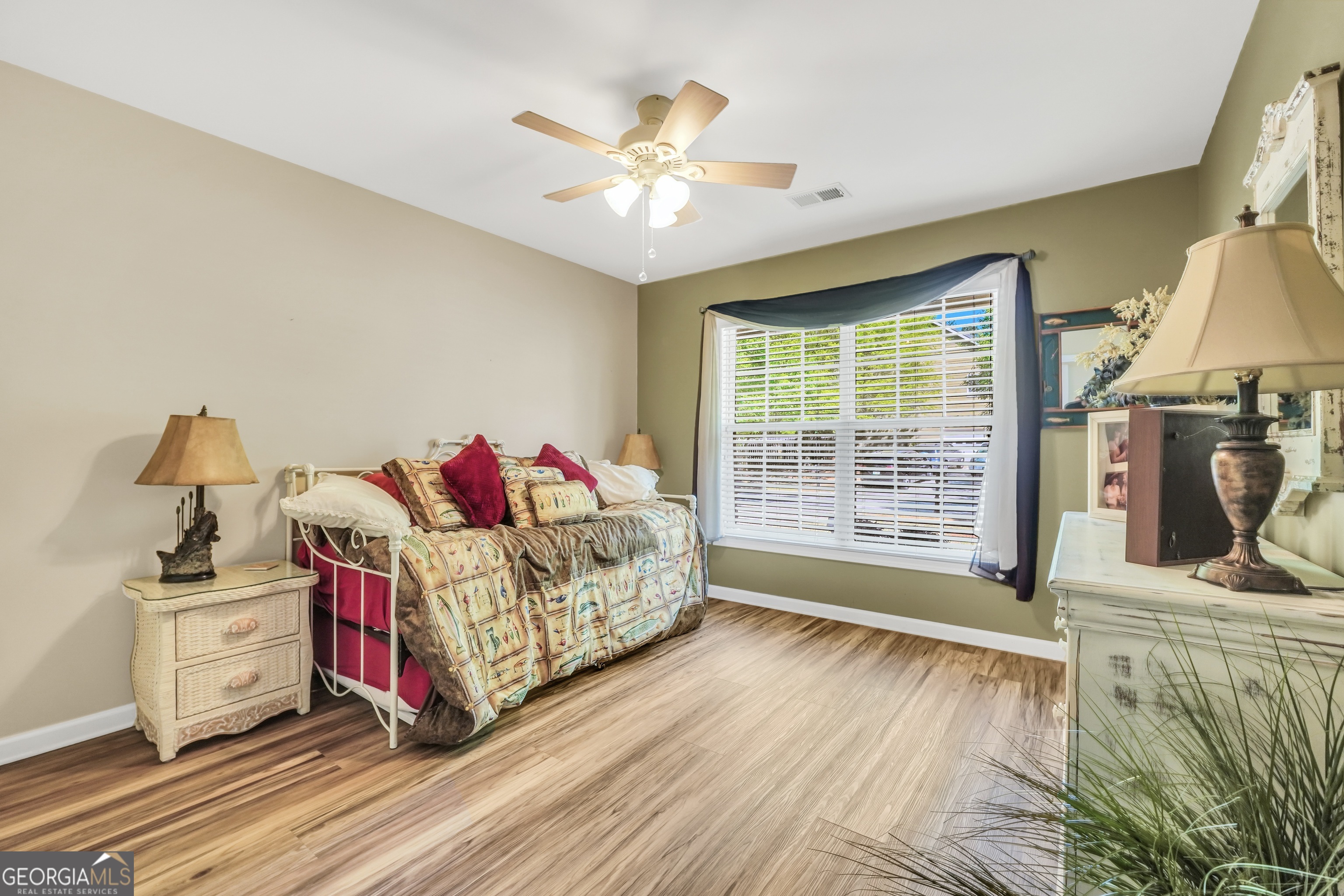 164 Lantana Drive Locust Grove, GA 30248 - Photo 24 of 34 a bed room with a bed and a window