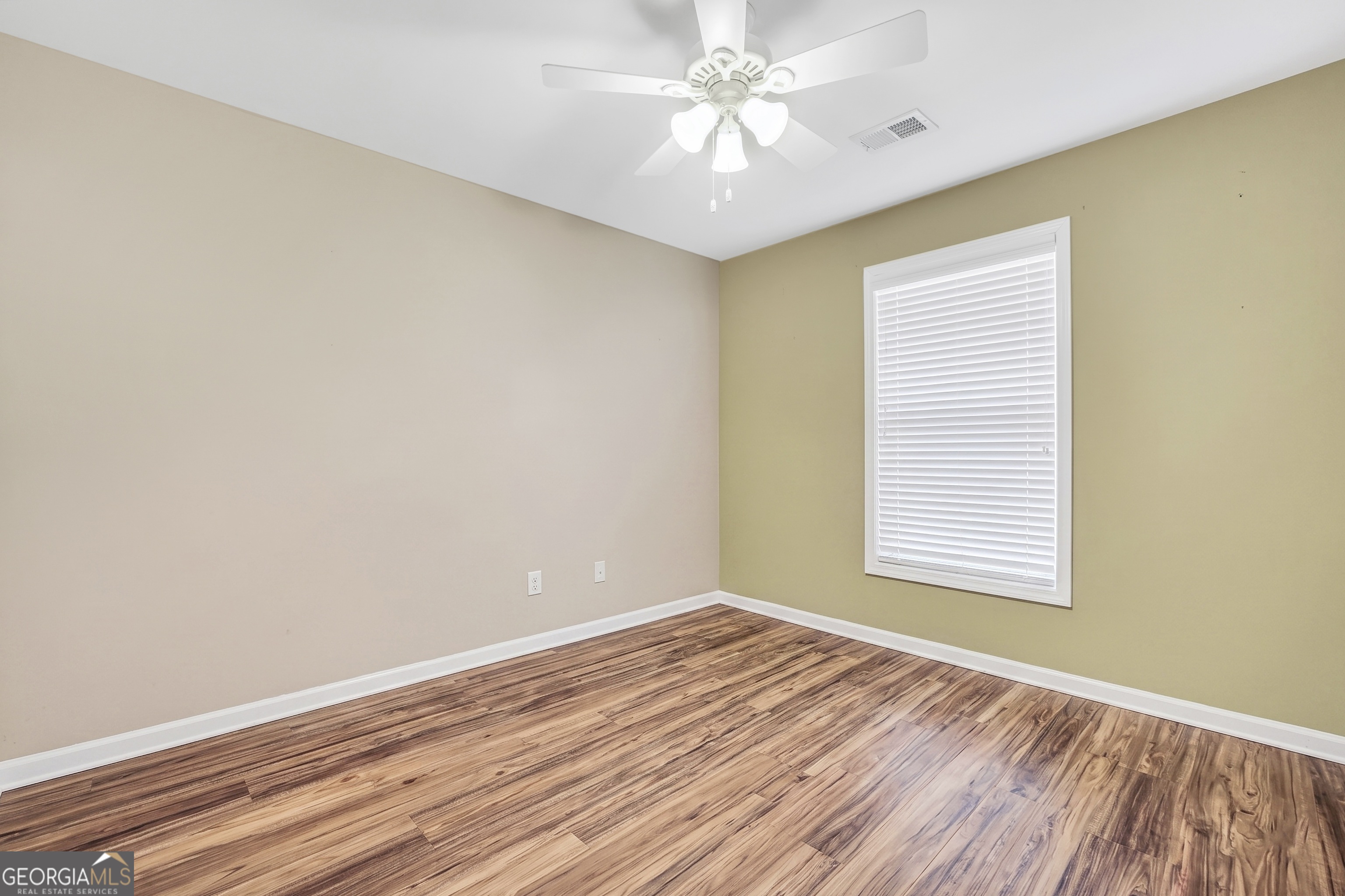 164 Lantana Drive Locust Grove, GA 30248 - Photo 28 of 34 wooden floor in an empty room with a window