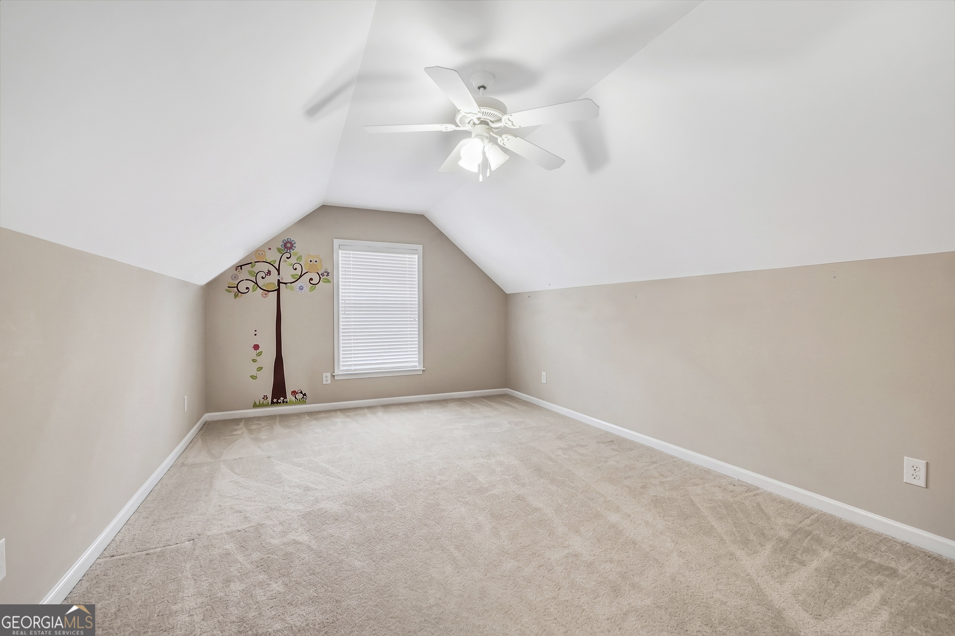 164 Lantana Drive Locust Grove, GA 30248 - Photo 30 of 34 an empty room with a ceiling fan and a window