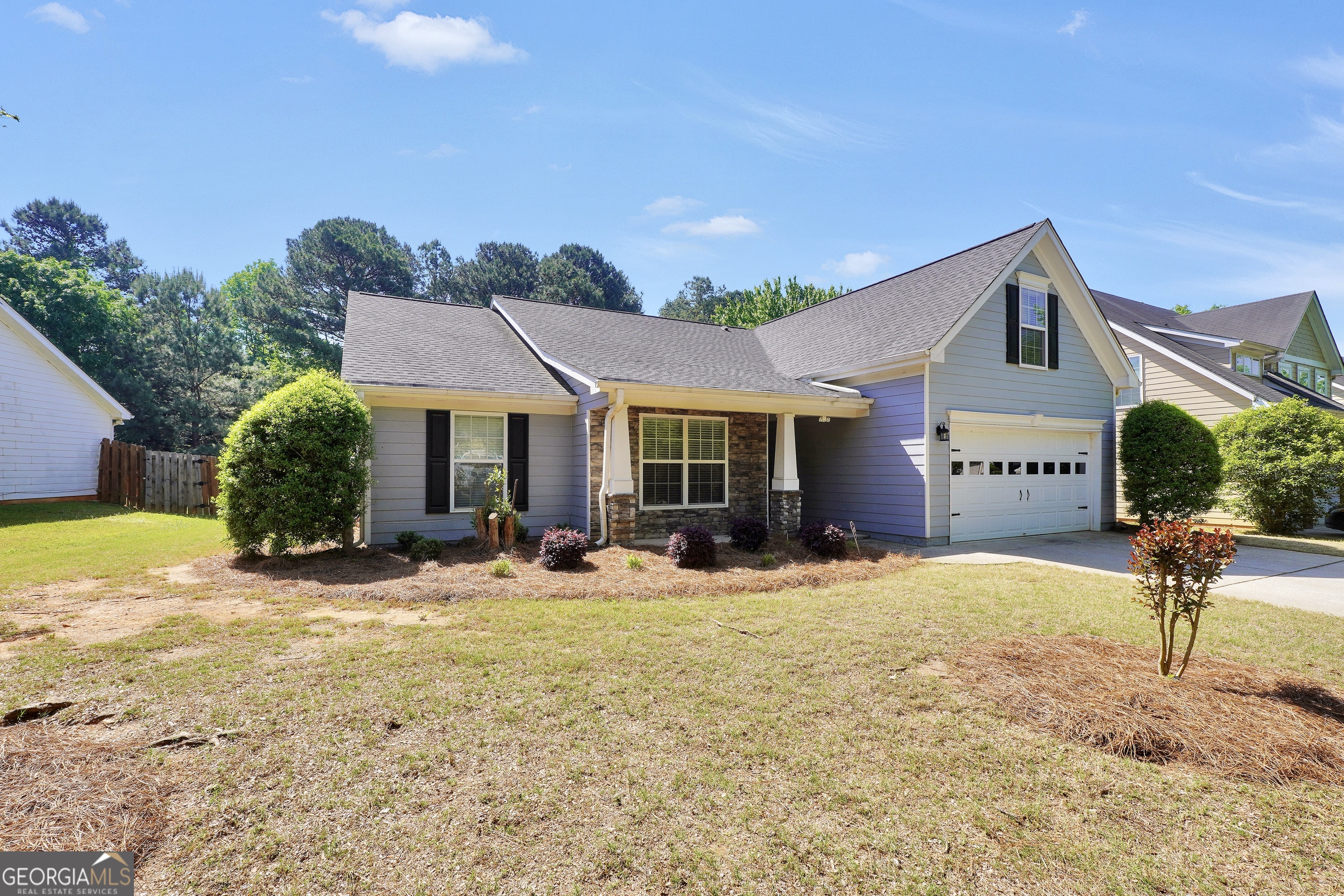 164 Lantana Drive Locust Grove, GA 30248 - Photo 3 of 34 a front view of a house with garden