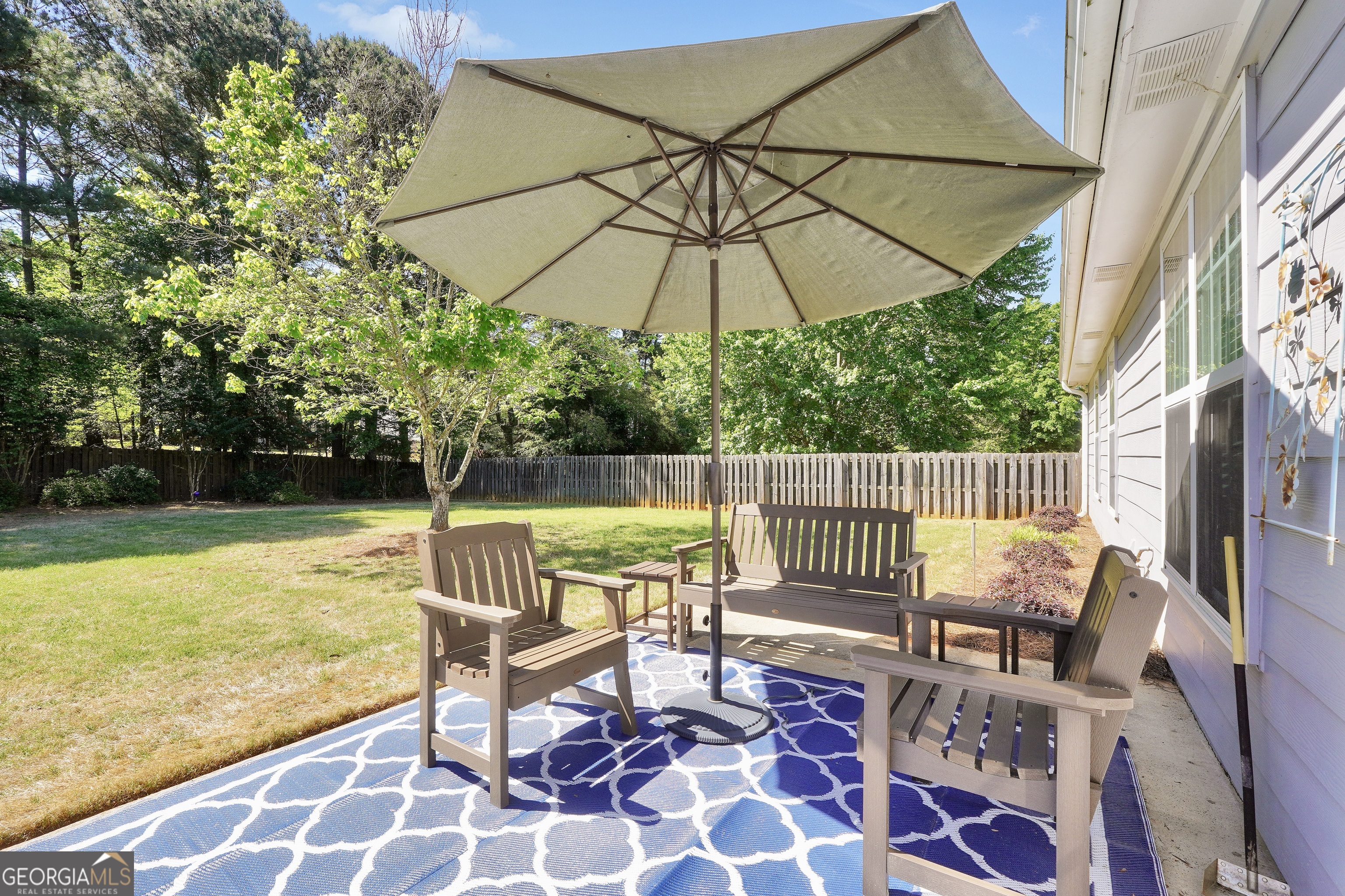 164 Lantana Drive Locust Grove, GA 30248 - Photo 31 of 34 a view of a chair and tables on the roof deck