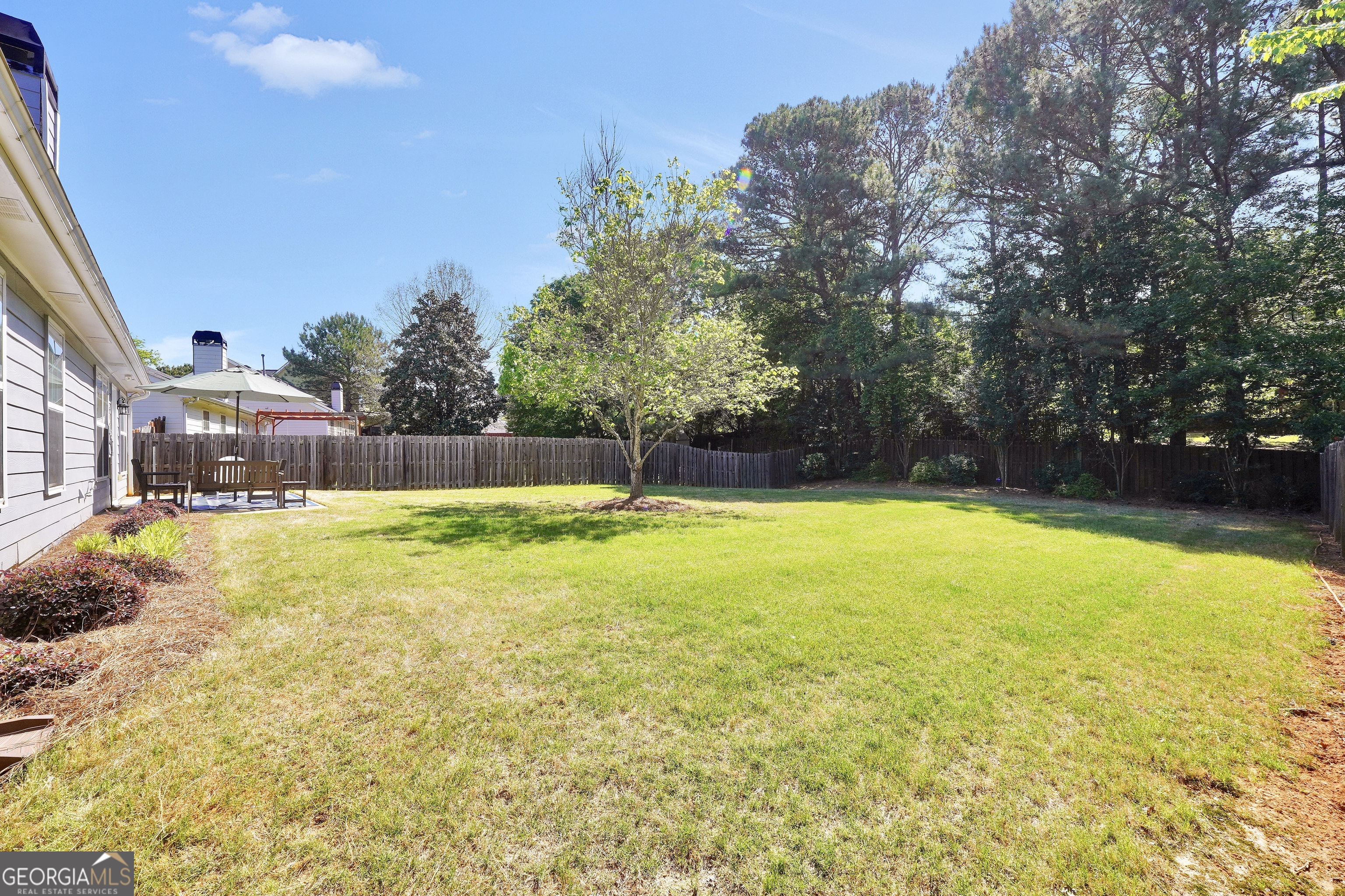 164 Lantana Drive Locust Grove, GA 30248 - Photo 33 of 34 a swimming pool with outdoor seating and yard