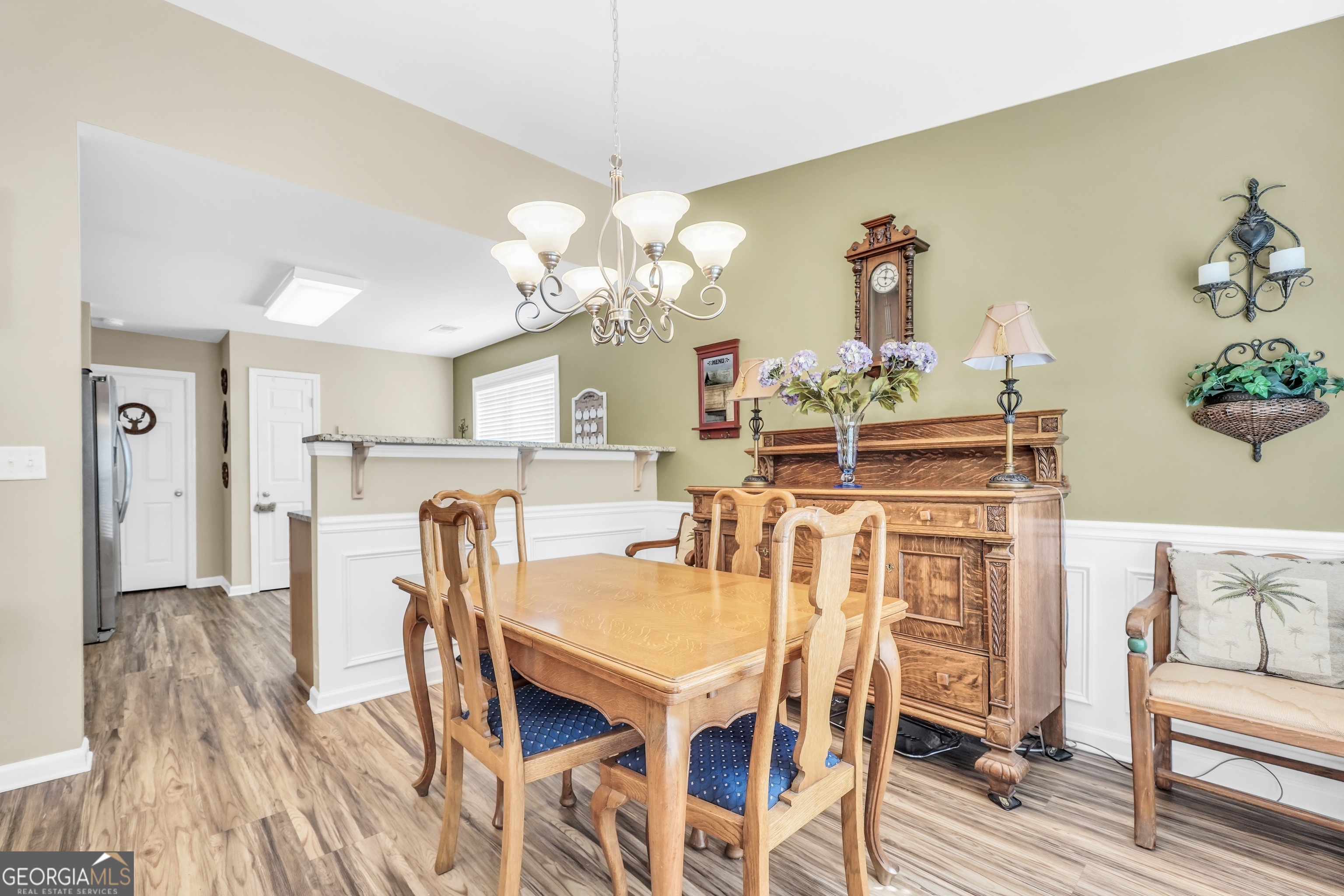 164 Lantana Drive Locust Grove, GA 30248 - Photo 9 of 34 a view of a dining room with furniture and wooden floor