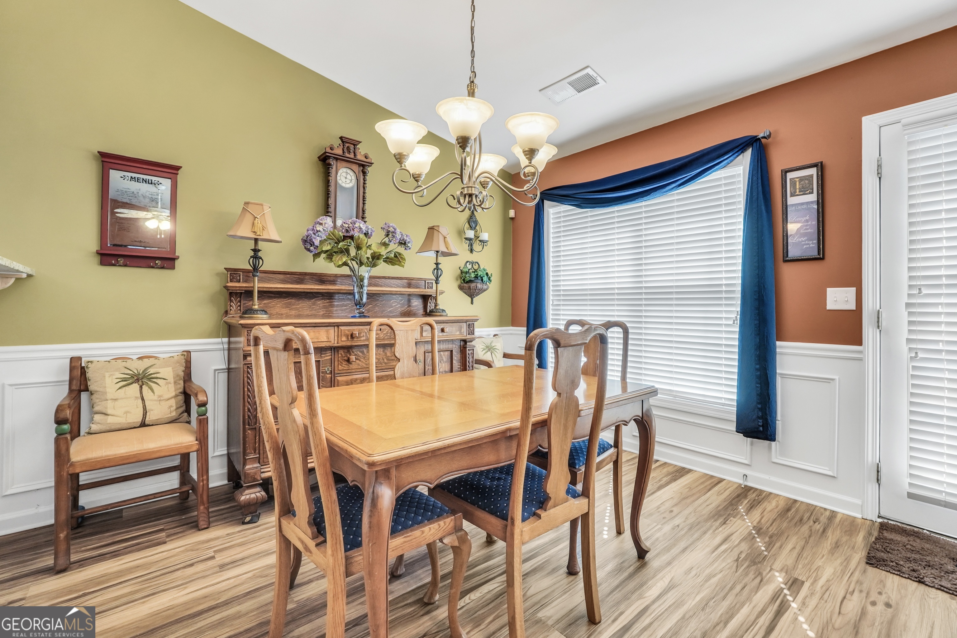 164 Lantana Drive Locust Grove, GA 30248 - Photo 10 of 34 a view of a dining room with furniture and wooden floor
