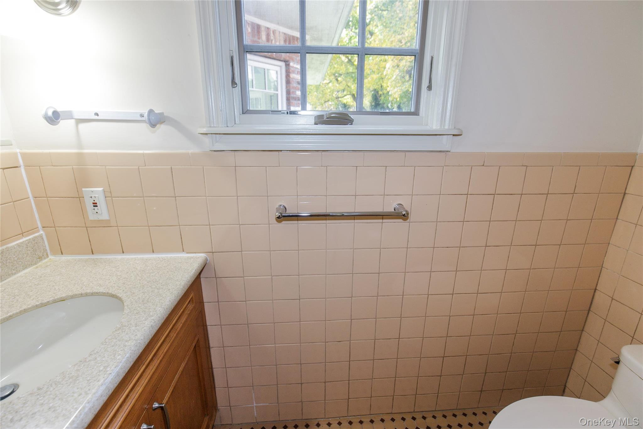 18 Lighthouse Road Kings Point, NY 11024 - Photo 13 of 36 a bathroom with a sink toilet and shower