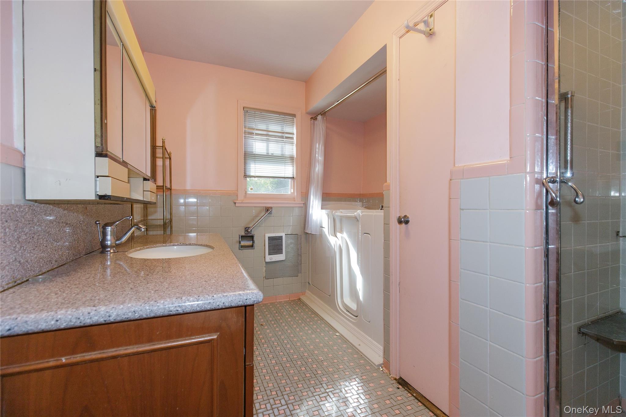 18 Lighthouse Road Kings Point, NY 11024 - Photo 19 of 36 a kitchen with a refrigerator and a sink