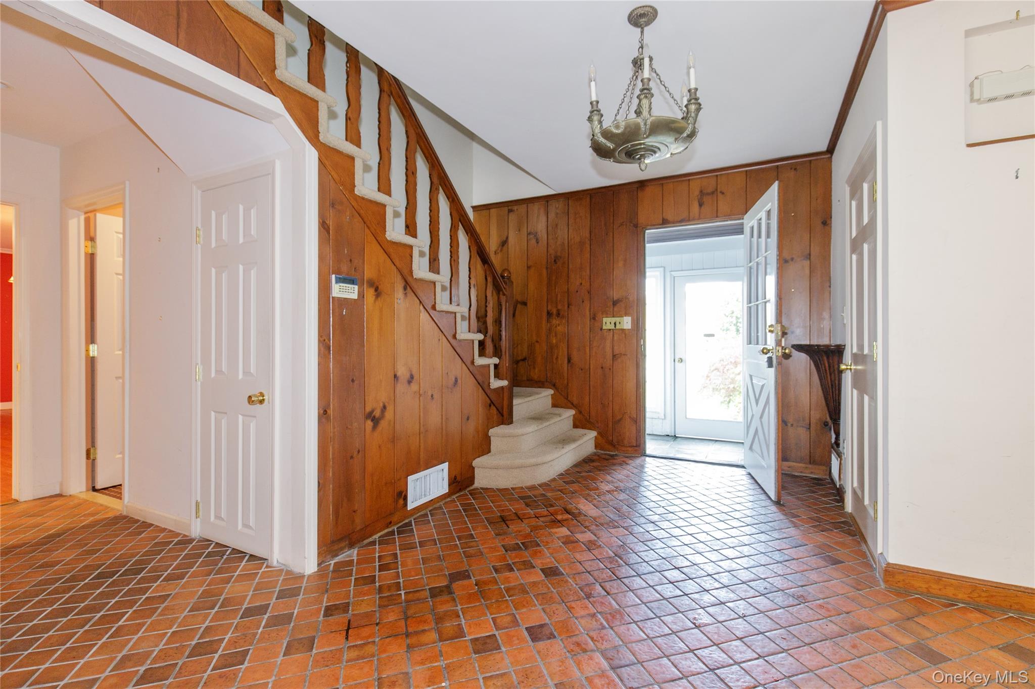 18 Lighthouse Road Kings Point, NY 11024 - Photo 3 of 36 a view of entryway with wooden floor and stairs