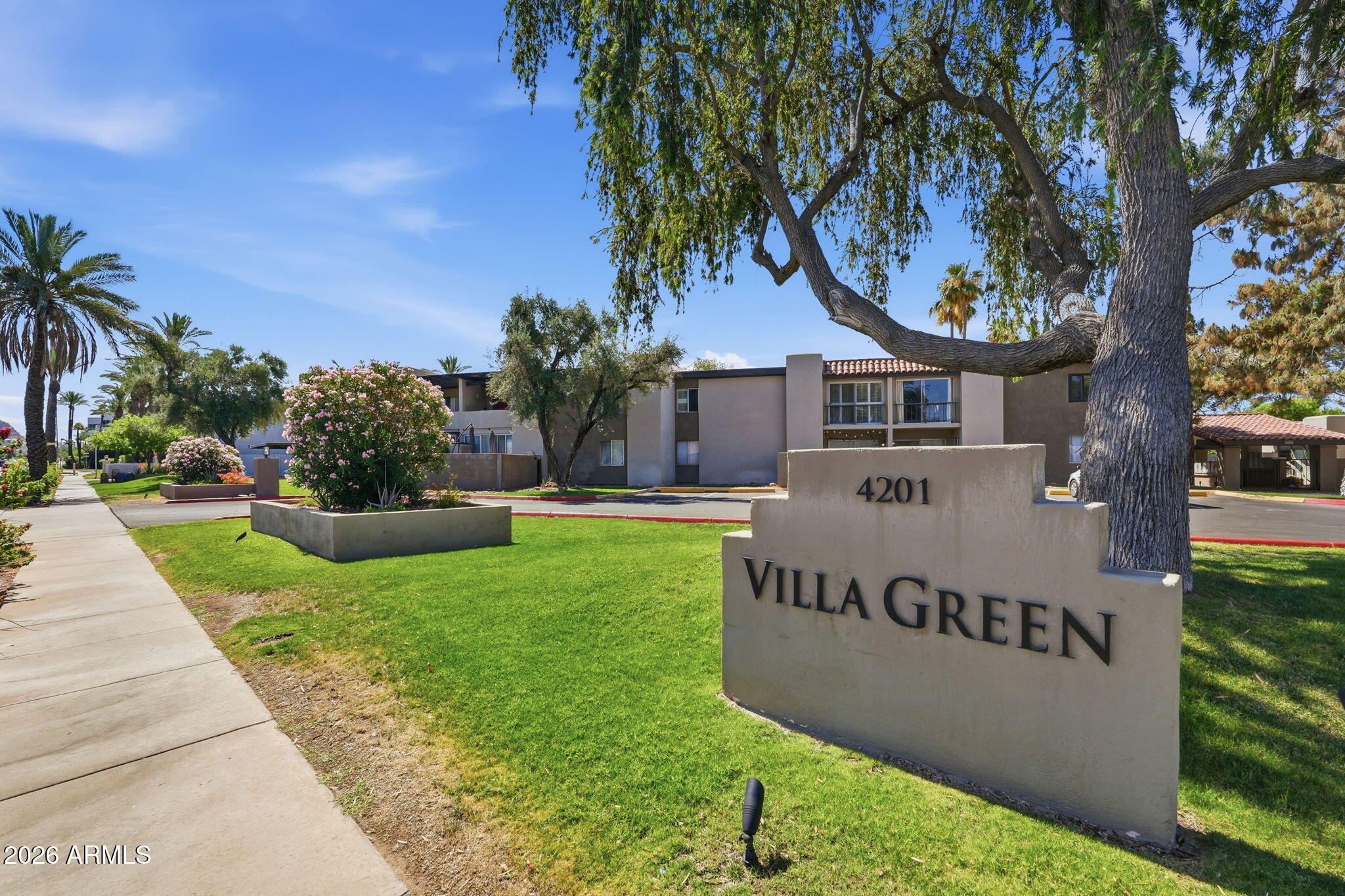 4201 East Camelback Road, Unit 34 Phoenix, AZ 85018 - Photo 15 of 19 a front view of a house with garden