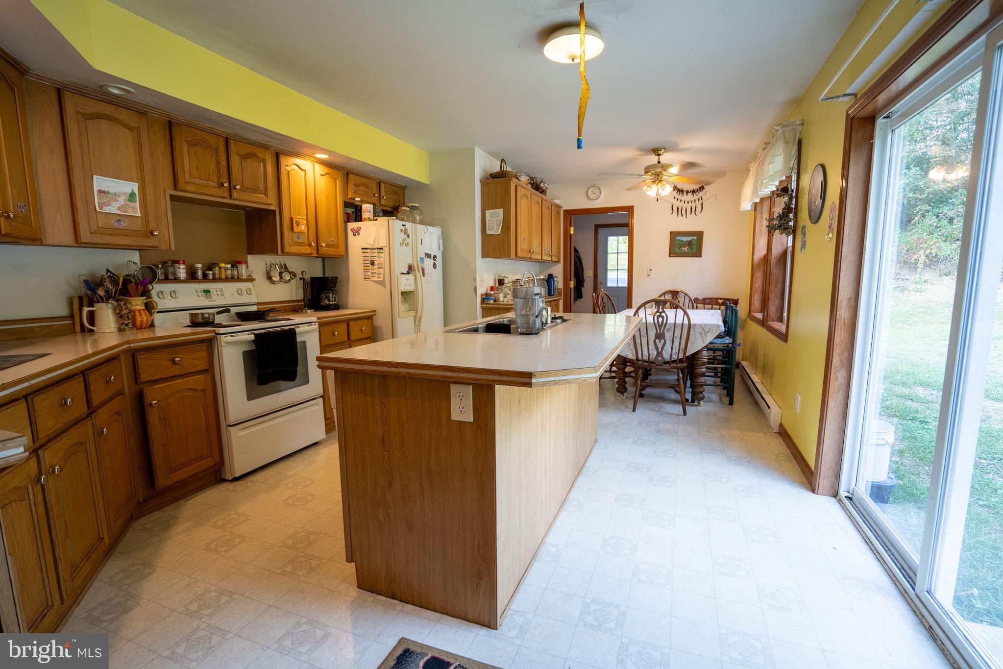 1950 Mesner Road Berkeley Springs, WV 25411 - Photo 12 of 34 a living room with stainless steel appliances granite countertop furniture a sink a washer and dryer