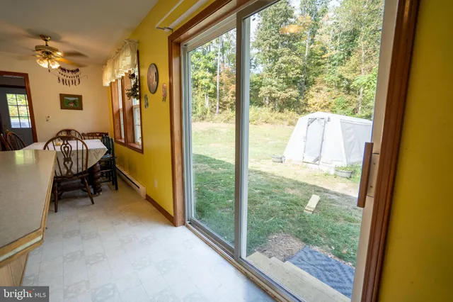 a view of a room with workspace and windows