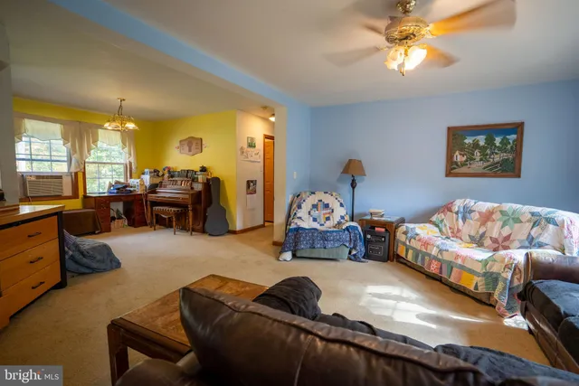 a bedroom with furniture and a chandelier