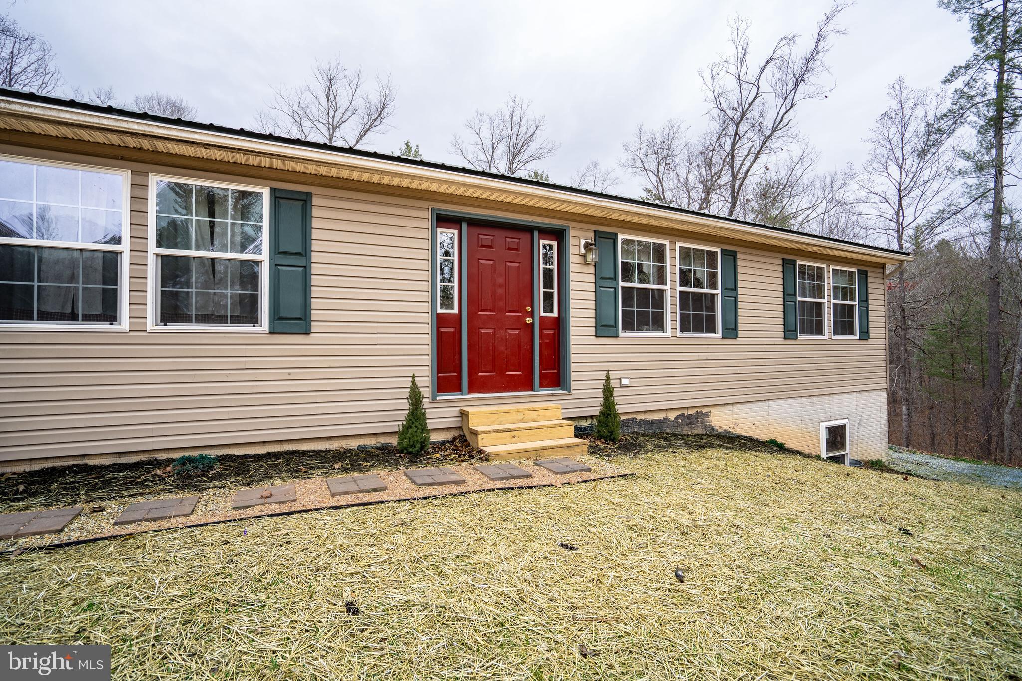 1950 Mesner Road Berkeley Springs, WV 25411 - Photo 2 of 34 a view of a house with a yard