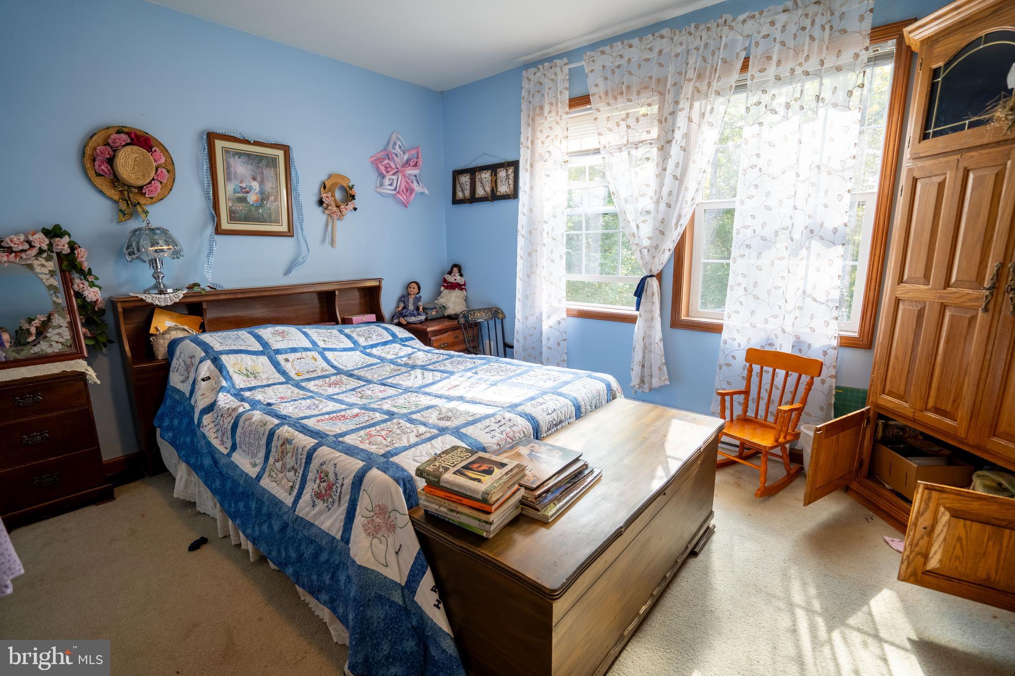 1950 Mesner Road Berkeley Springs, WV 25411 - Photo 22 of 34 a bed sitting in a bedroom next to a window