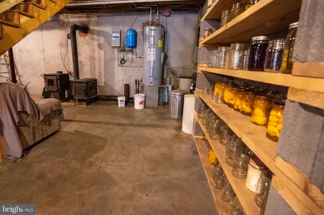 a view of living room with furniture and stairs