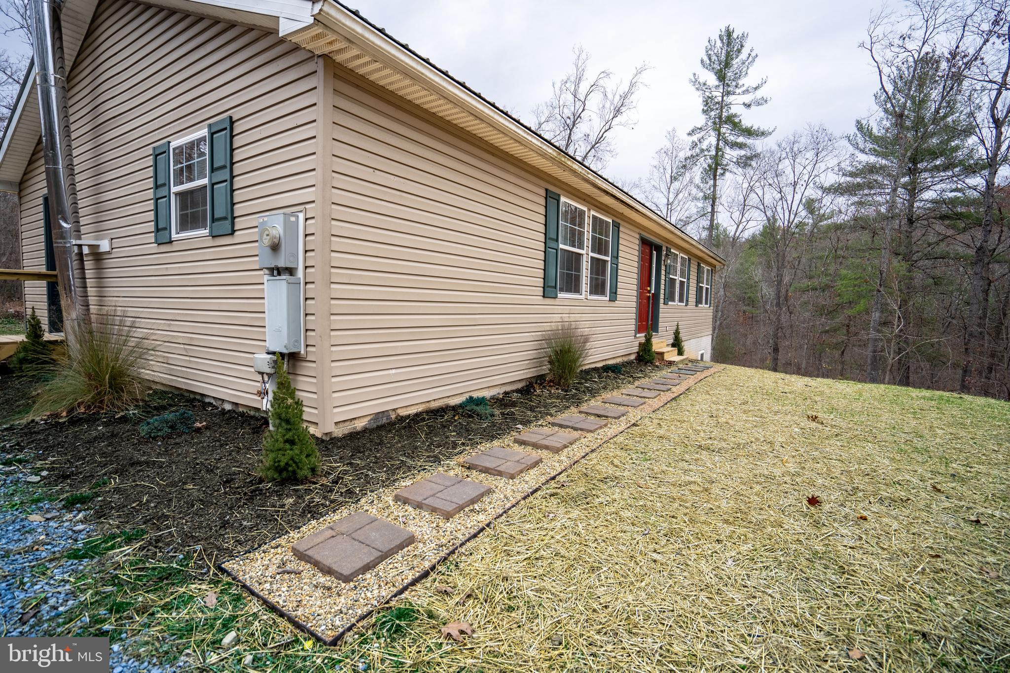 1950 Mesner Road Berkeley Springs, WV 25411 - Photo 3 of 34 a view of a house with a yard