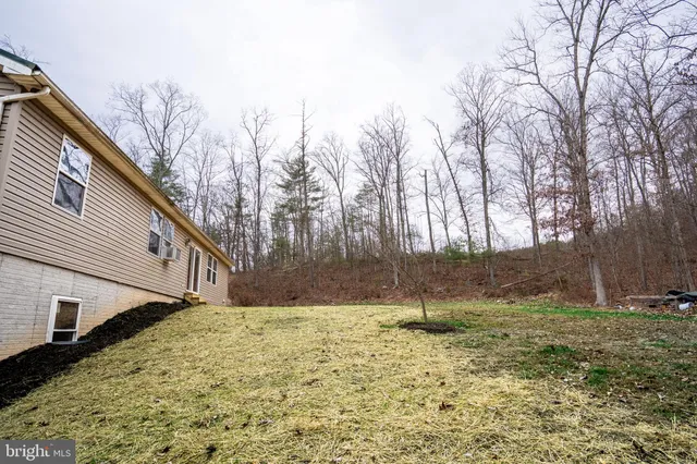 a backyard of a house with lots of green space