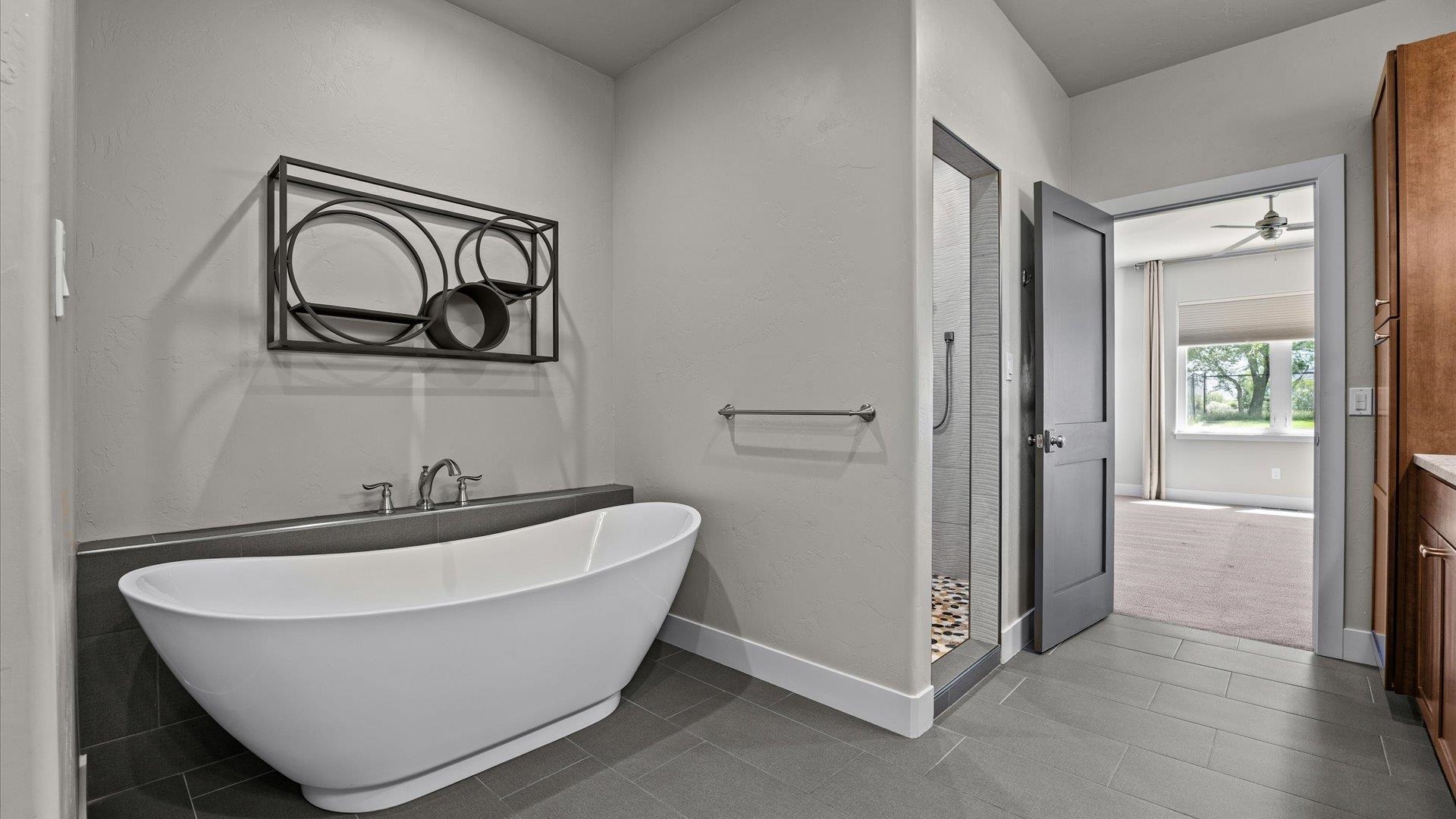2041 J J 1/2 Road Fruita, CO 81521 - Photo 19 of 42 a bathroom with a bathtub and a sink