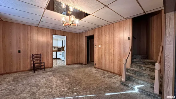 a view of empty room with wooden walls