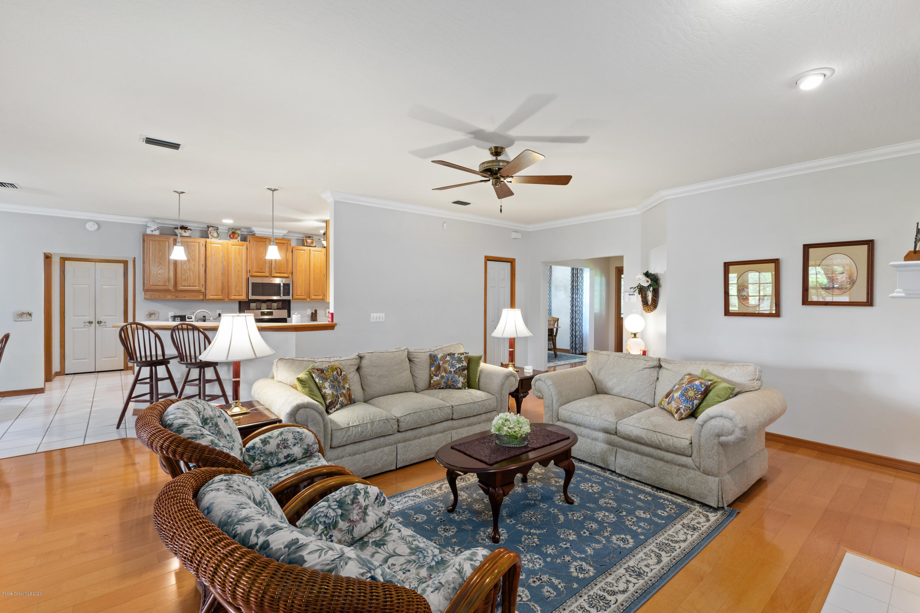 4255 Turtle Mound Road Melbourne, FL 32934 - Photo 11 of 46 a living room with furniture and kitchen view