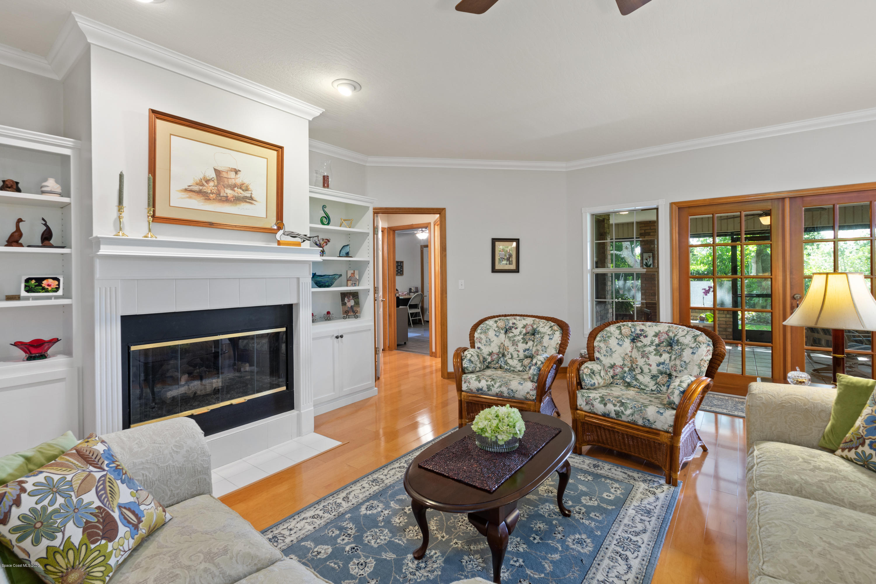 4255 Turtle Mound Road Melbourne, FL 32934 - Photo 12 of 46 a living room with furniture and a fireplace