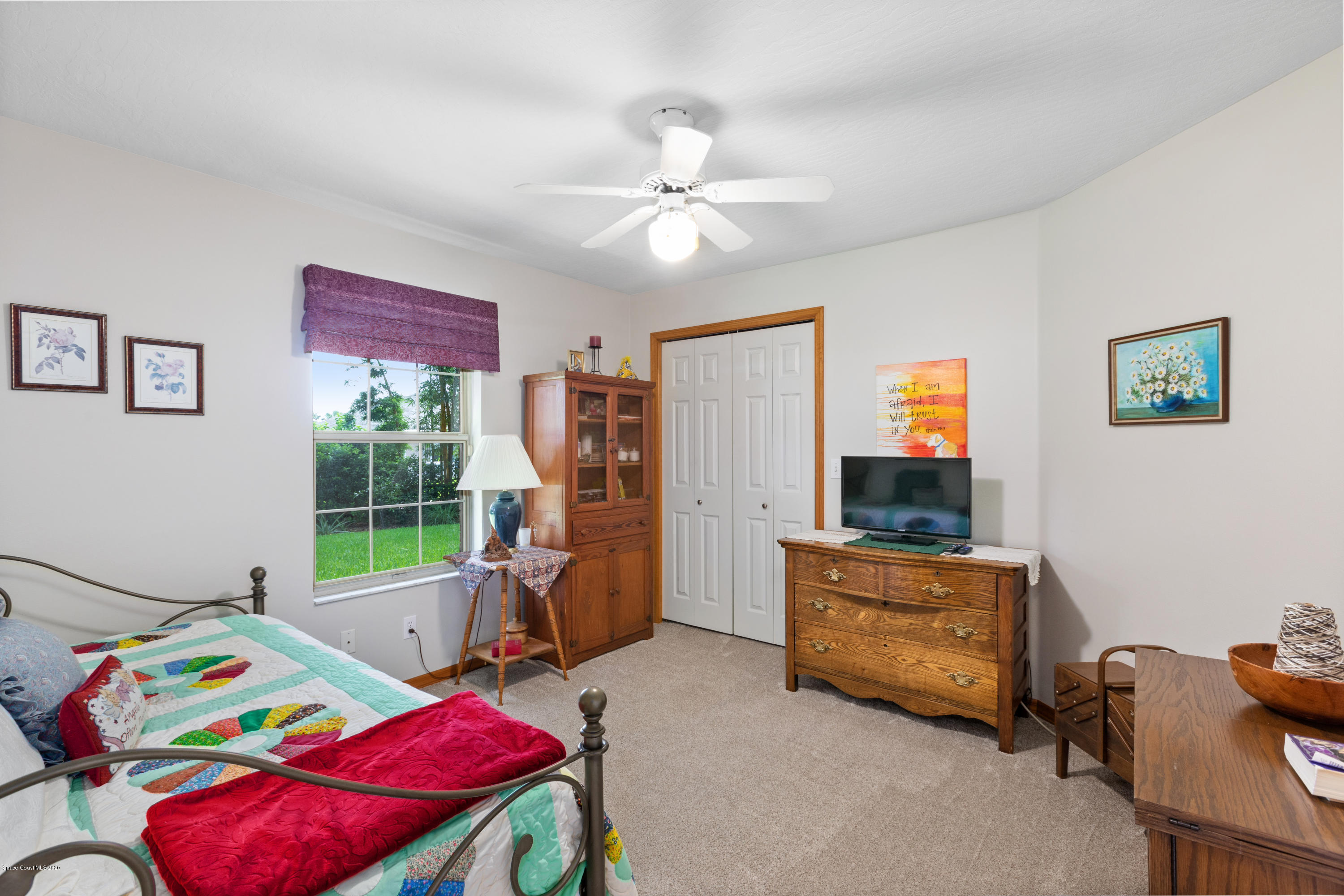 4255 Turtle Mound Road Melbourne, FL 32934 - Photo 15 of 46 a bedroom with furniture and a bed
