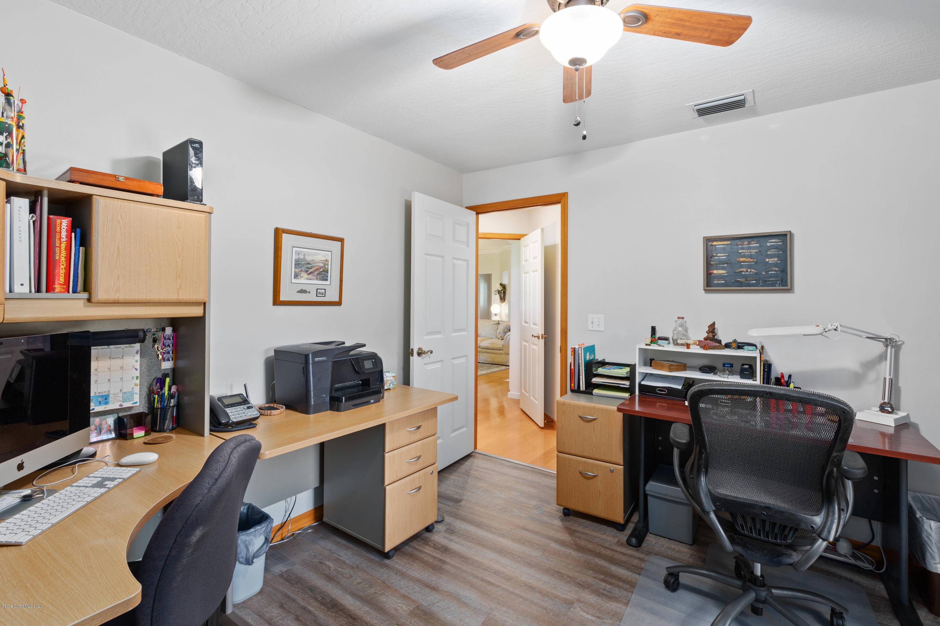 4255 Turtle Mound Road Melbourne, FL 32934 - Photo 19 of 46 a view of a workspace with furniture and a workspace