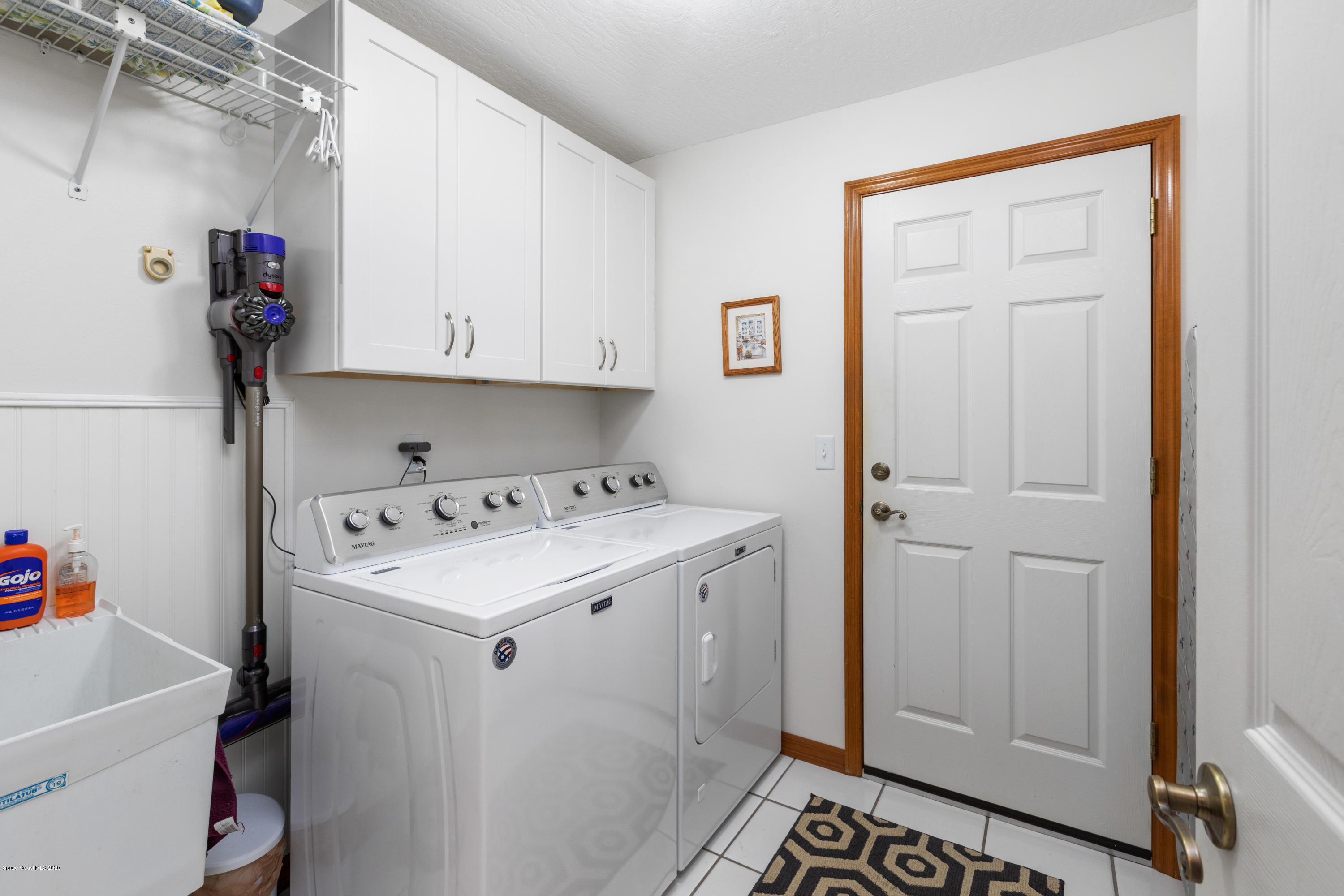 4255 Turtle Mound Road Melbourne, FL 32934 - Photo 30 of 46 a utility room with dryer and washer