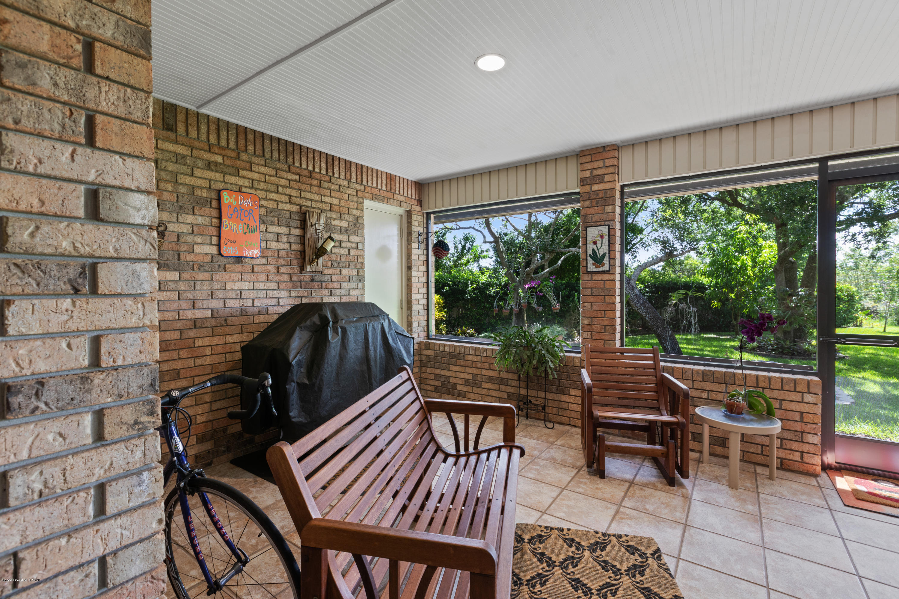 4255 Turtle Mound Road Melbourne, FL 32934 - Photo 32 of 46 a sitting area with furniture and wooden floor