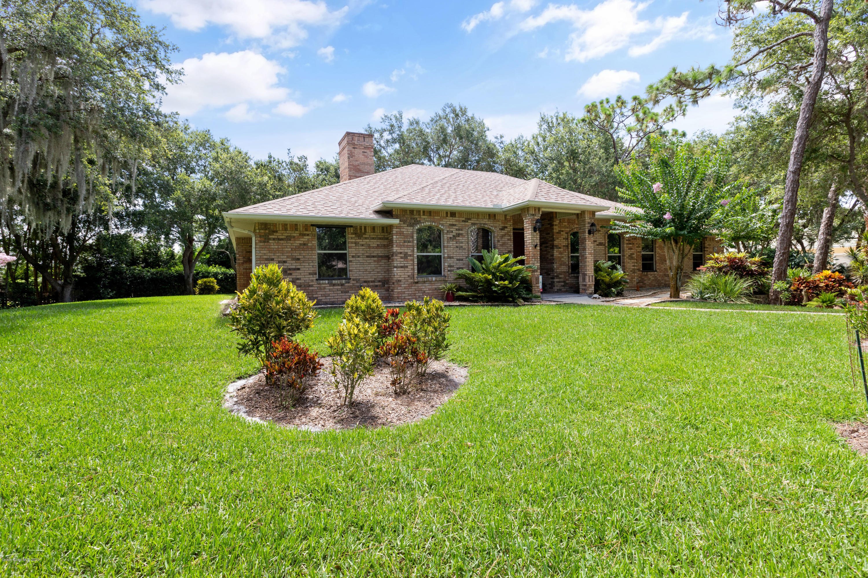 4255 Turtle Mound Road Melbourne, FL 32934 - Photo 5 of 46 a front view of a house with a yard