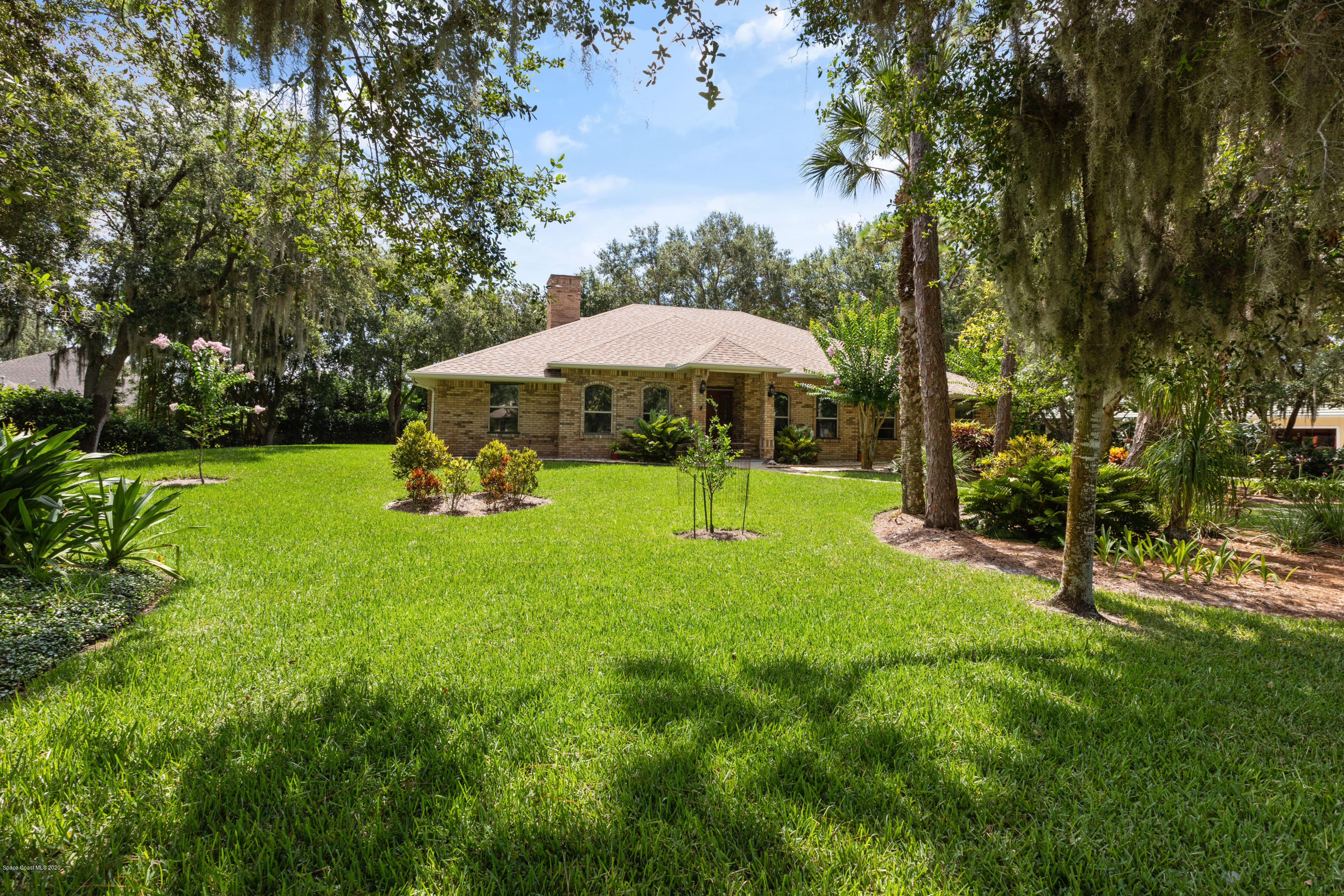 4255 Turtle Mound Road Melbourne, FL 32934 - Photo 45 of 46 a view of a garden with a slide