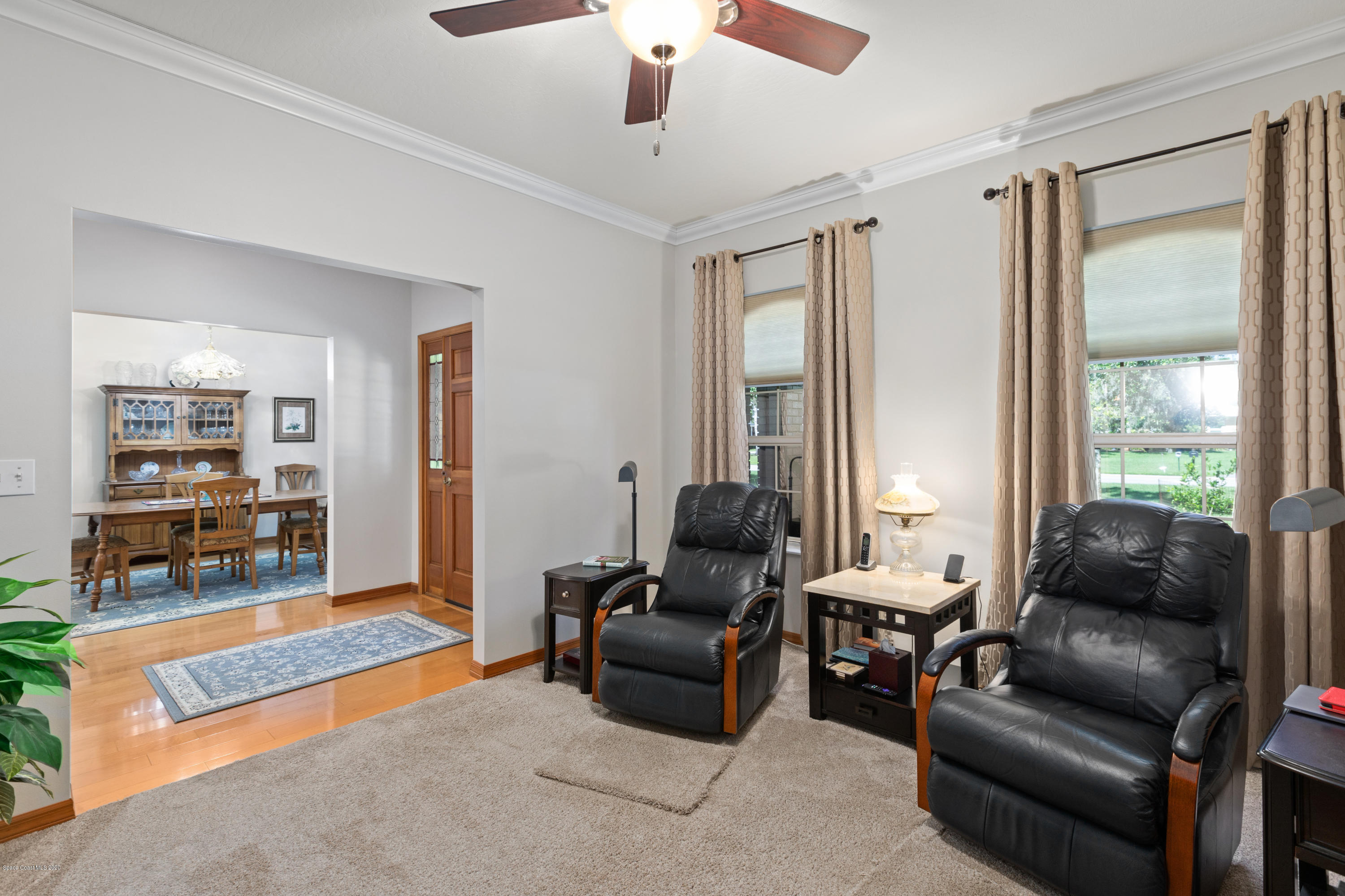 4255 Turtle Mound Road Melbourne, FL 32934 - Photo 7 of 46 a living room with furniture and a window
