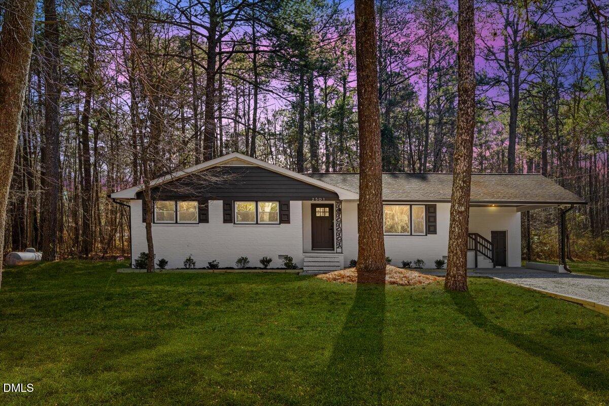 2501 Old Mill Road Rocky Mount, NC 27803 - Photo 1 of 41 a front view of a house with a yard