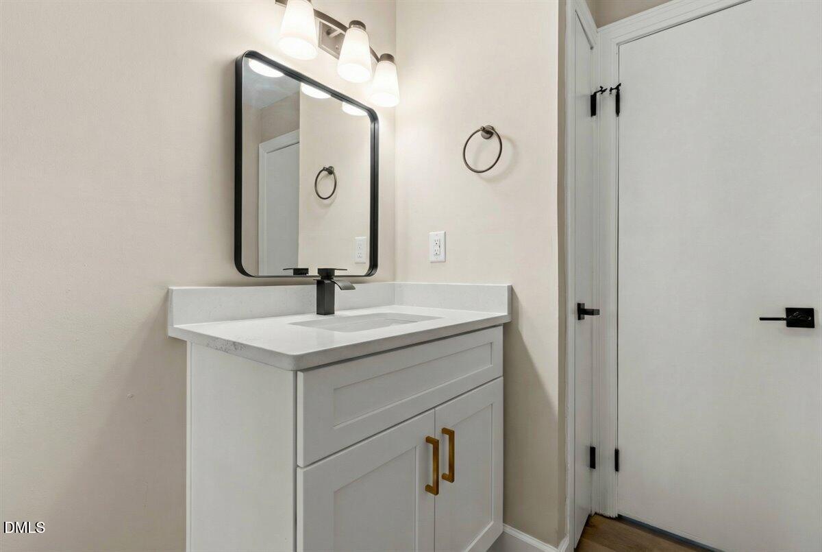 2501 Old Mill Road Rocky Mount, NC 27803 - Photo 19 of 41 a bathroom with a sink and a mirror